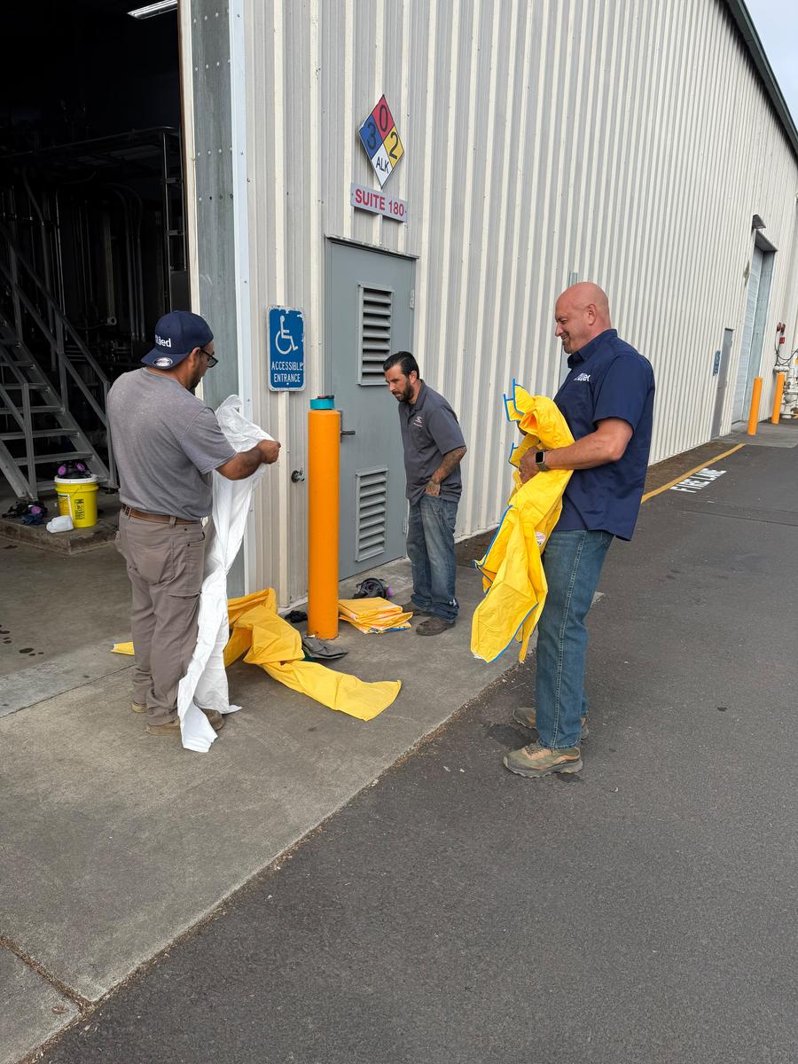 Allied team donning Level B hazmat suits