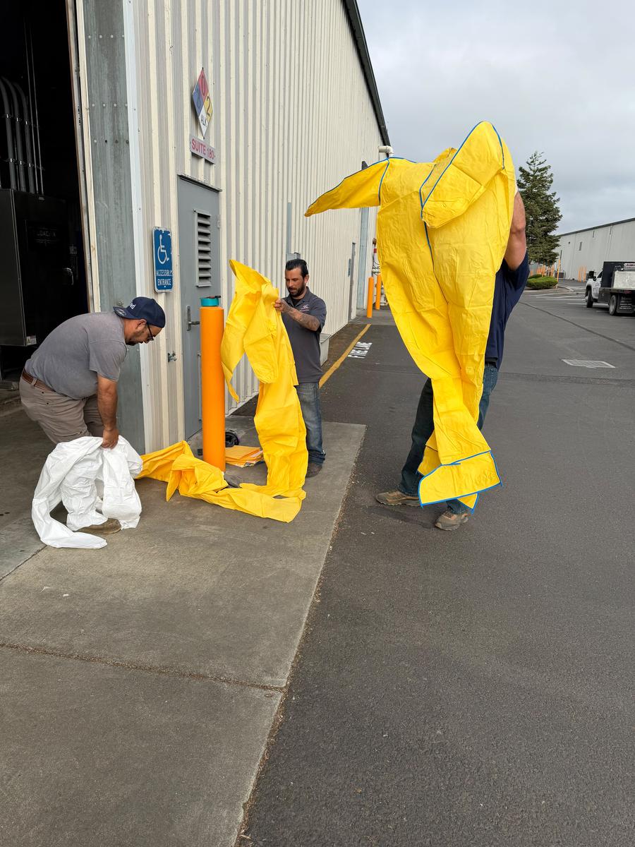 Allied biohazard team suiting up for decontamination