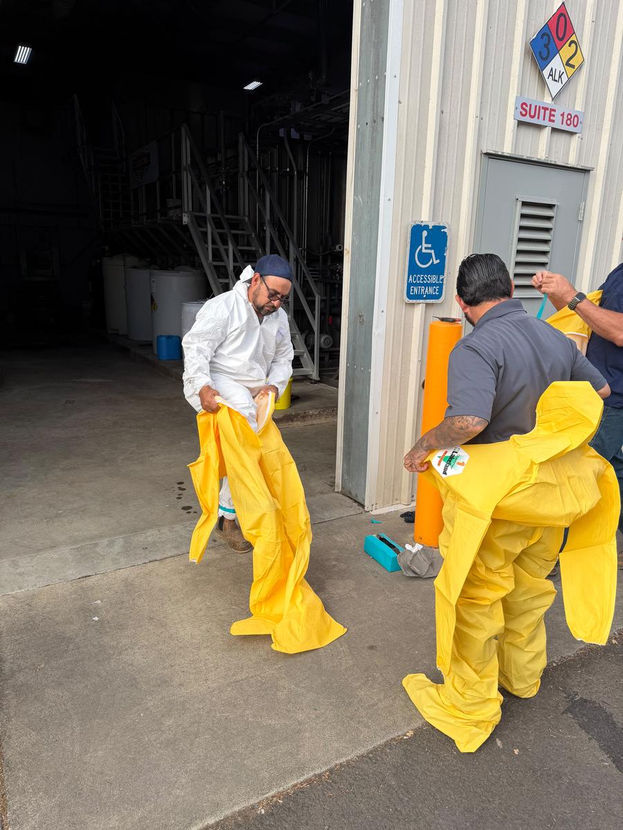 Allied technicians preparing Level B PPE