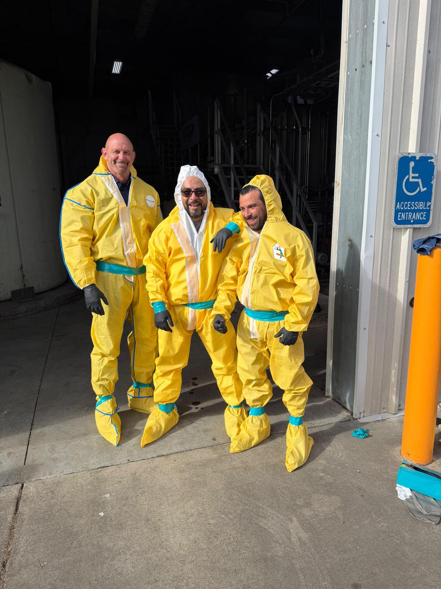 Allied Restoration team in full biohazard protective suits