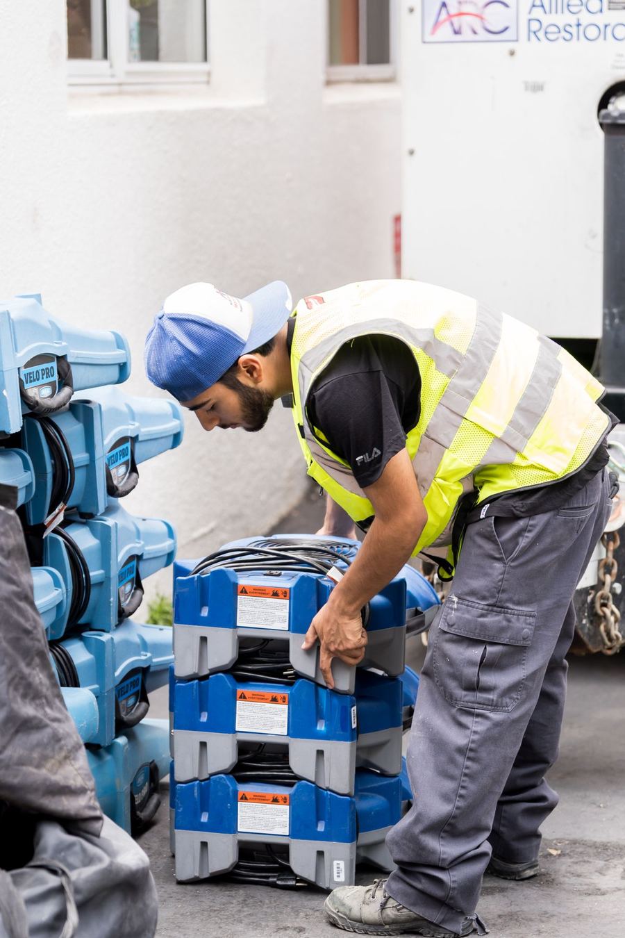 Allied technician loading restoration equipment