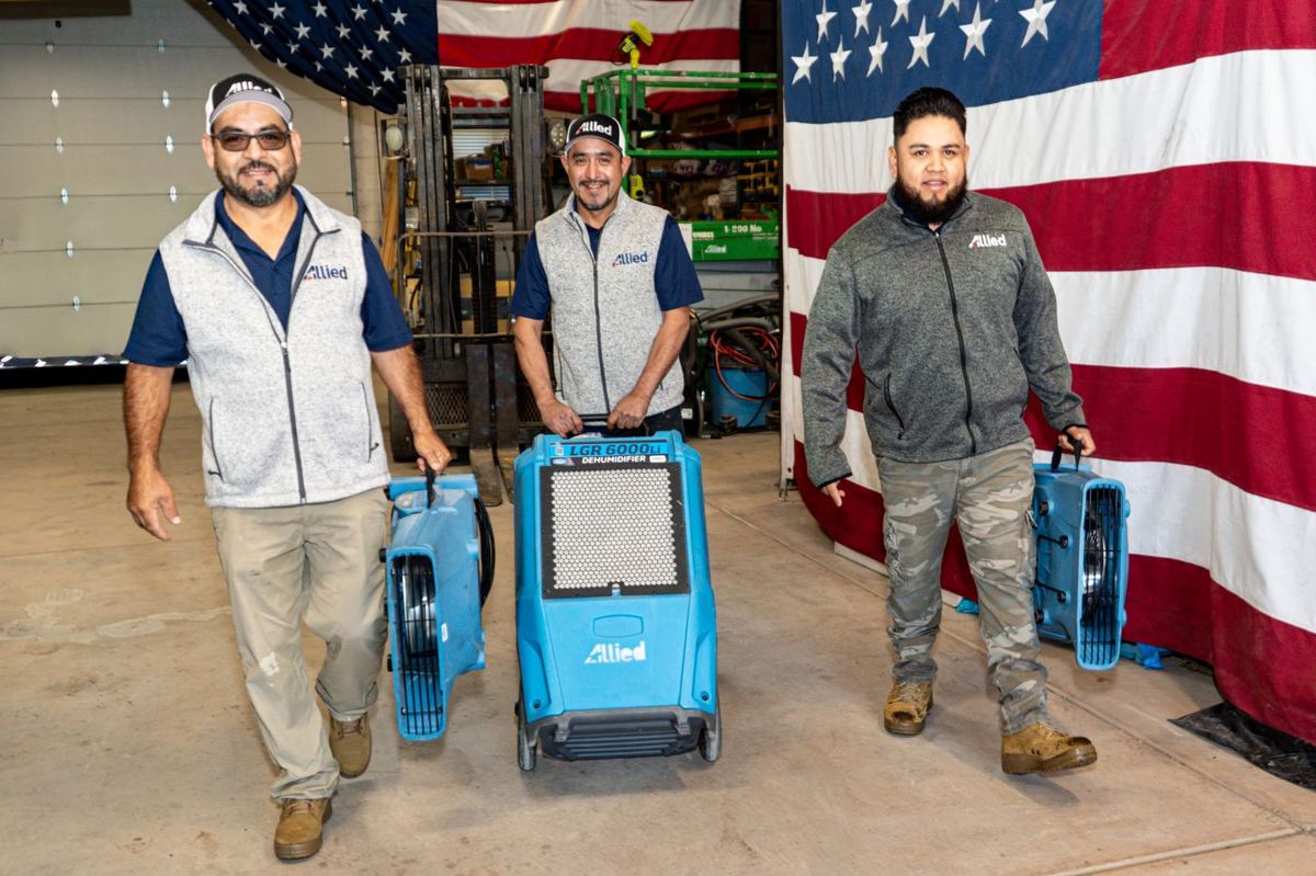 Allied Restoration technicians with LGR dehumidifiers and air movers